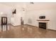 Open-concept living room with tile floors, a fireplace, and a view into the kitchen at 4405 Testarossa Ln, North Las Vegas, NV 89081