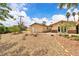 Spacious backyard featuring gravel landscaping and a detached structure at 4678 Saddle Pl, Las Vegas, NV 89119