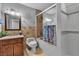 Bathroom featuring a vanity, toilet, and a shower-tub combination with tiled walls at 4678 Saddle Pl, Las Vegas, NV 89119