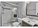 This bathroom features a glass enclosed tiled shower, modern vanity and neutral paint at 4678 Saddle Pl, Las Vegas, NV 89119