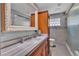 Bathroom featuring dual vanity, tile flooring, and a shower and tub at 4678 Saddle Pl, Las Vegas, NV 89119