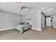 Large bedroom features wood look flooring, a ceiling fan, and ample natural light at 4678 Saddle Pl, Las Vegas, NV 89119