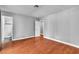 This bedroom features wood floors and an ensuite bathroom with tiled shower at 4678 Saddle Pl, Las Vegas, NV 89119