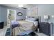 Bedroom featuring neutral walls, tile floors, and access to an ensuite bathroom at 4678 Saddle Pl, Las Vegas, NV 89119