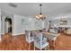 Inviting dining area featuring hardwood floors and stylish furnishings at 4678 Saddle Pl, Las Vegas, NV 89119