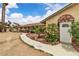 Home's side entrance bordered by lush landscaping, offering a private retreat at 4678 Saddle Pl, Las Vegas, NV 89119