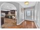 Open-concept foyer flowing into a modern kitchen, highlighted by hardwood floors at 4678 Saddle Pl, Las Vegas, NV 89119