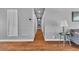 Neutral hallway with hardwood floors, leading to various rooms in the home at 4678 Saddle Pl, Las Vegas, NV 89119