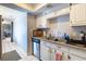 Kitchen with white cabinetry, neutral countertops, and stainless steel appliances at 4678 Saddle Pl, Las Vegas, NV 89119