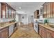 Well-appointed kitchen with stainless steel appliances, granite countertops, and a breakfast nook at 4678 Saddle Pl, Las Vegas, NV 89119