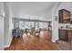 Spacious living room with hardwood floors, expansive windows, and natural light at 4678 Saddle Pl, Las Vegas, NV 89119