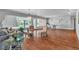 Bright living room with hardwood floors, garden view, and stylish furnishings at 4678 Saddle Pl, Las Vegas, NV 89119