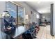A multipurpose living space with a large window, desk and exercise equipment at 4678 Saddle Pl, Las Vegas, NV 89119