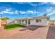 Backyard featuring a green lawn, a covered patio, and an external metal storage shed at 5200 Longridge Ave, Las Vegas, NV 89146