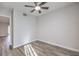 This bedroom features hardwood floors and a ceiling fan at 5200 Longridge Ave, Las Vegas, NV 89146