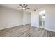 Large bedroom showing ensuite bath, ceiling fan, closet, and wood flooring at 5200 Longridge Ave, Las Vegas, NV 89146
