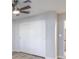 Bedroom featuring closet with sliding doors, ceiling fan, and neutral paint scheme at 5200 Longridge Ave, Las Vegas, NV 89146