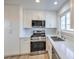 Contemporary kitchen features white cabinets, stainless steel appliances, and light countertops at 5200 Longridge Ave, Las Vegas, NV 89146