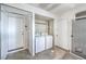 Functional laundry room with washer, dryer, and ample storage space at 5200 Longridge Ave, Las Vegas, NV 89146