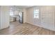 Modern living room with stainless steel appliances and hardwood floors at 5200 Longridge Ave, Las Vegas, NV 89146