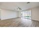 Spacious living room with hardwood floors and sliding glass doors at 5200 Longridge Ave, Las Vegas, NV 89146
