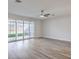 Bright living room features sliding glass doors and hardwood floors at 5200 Longridge Ave, Las Vegas, NV 89146