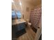 Well-lit bathroom featuring a modern vanity with ample countertop space at 5404 Walcott Dr, Las Vegas, NV 89118
