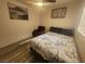 Bright bedroom featuring modern flooring and cozy furnishings at 5404 Walcott Dr, Las Vegas, NV 89118