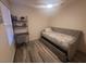 Inviting bedroom featuring a bed and a dedicated workspace at 5404 Walcott Dr, Las Vegas, NV 89118