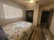 Cozy bedroom featuring a ceiling fan, closet, and natural light from the window at 5404 Walcott Dr, Las Vegas, NV 89118