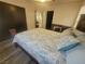 Comfortable bedroom featuring a cozy seating area and view into the en-suite bathroom at 5404 Walcott Dr, Las Vegas, NV 89118