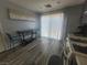 Kitchen nook with seating, kitchen appliances, and natural light shining through a glass door at 5404 Walcott Dr, Las Vegas, NV 89118