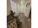 Bright entryway featuring wood-look floors, a window with blinds, and neutral decor at 5404 Walcott Dr, Las Vegas, NV 89118