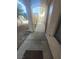 Inviting covered front porch with dual entry doors, a small window, and secure gate at 5404 Walcott Dr, Las Vegas, NV 89118