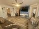 Open concept living room featuring modern decor, hard surface flooring, and ample natural light at 5404 Walcott Dr, Las Vegas, NV 89118