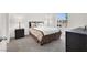 Well-lit bedroom with a comfortable bed, stylish furniture, and a large window offering views of the outdoors at 5609 Steampunk St, Las Vegas, NV 89118