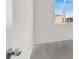 Bright bedroom with large windows that allow for abundant natural light with neutral carpet flooring at 5609 Steampunk St, Las Vegas, NV 89118