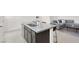 Granite kitchen island with sink and bar stool seating that opens up to the living room at 5609 Steampunk St, Las Vegas, NV 89118