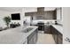 Spacious kitchen featuring stainless steel appliances, a large island, and a breakfast bar at 5609 Steampunk St, Las Vegas, NV 89118