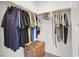Organized walk-in closet with hanging rods, shelves, and a storage basket, maximizing space and convenience at 5609 Steampunk St, Las Vegas, NV 89118