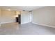 Open-concept living room featuring tile floors, a neutral palette, and ample natural light at 605 S Royal Crest Cir # 20, Las Vegas, NV 89169