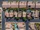 A high aerial view of a neighborhood featuring single-Gathering homes, many with private pools and desert landscaping at 6148 Whitelion Walk St, Las Vegas, NV 89148