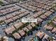 This aerial showcases homes in the desert, some with pools, and highlights 6148 Whitelion Walk's neighborhood at 6148 Whitelion Walk St, Las Vegas, NV 89148