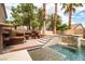 Stunning backyard featuring a pristine pool, relaxing spa, and well-designed outdoor kitchen, ideal for entertaining guests at 6148 Whitelion Walk St, Las Vegas, NV 89148