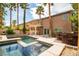 Private backyard offering a pristine pool, relaxing spa, built-in BBQ, and charming pergola for outdoor gatherings at 6148 Whitelion Walk St, Las Vegas, NV 89148