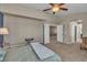 Spacious bedroom with carpet flooring and access to ensuite bathroom and walk-in closet at 6148 Whitelion Walk St, Las Vegas, NV 89148