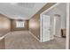 Neutral bedroom offering plush carpet, natural light, and a closet for storage at 6148 Whitelion Walk St, Las Vegas, NV 89148