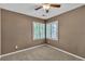 Well-lit bedroom featuring carpet flooring, and a window with shutters at 6148 Whitelion Walk St, Las Vegas, NV 89148