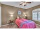 Cozy bedroom featuring carpet flooring, a ceiling fan, and a window with shutters at 6148 Whitelion Walk St, Las Vegas, NV 89148