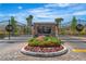 Stetson Ranch gated entrance features stone accents, beautiful flowers, and meticulous landscaping at 6148 Whitelion Walk St, Las Vegas, NV 89148